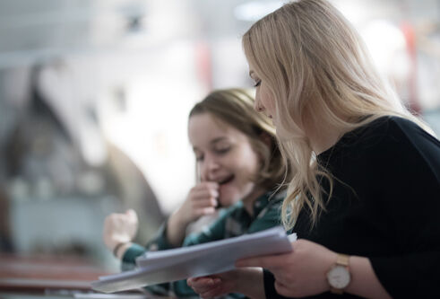Two students laughing