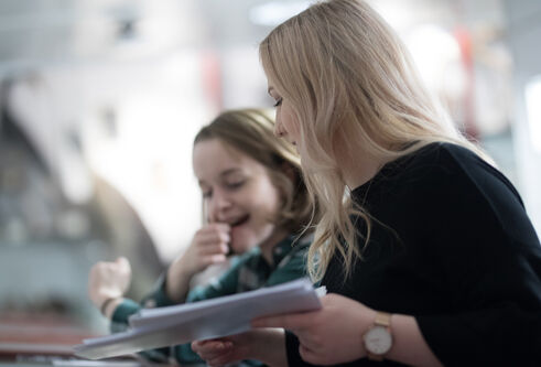 Two students looking at papers