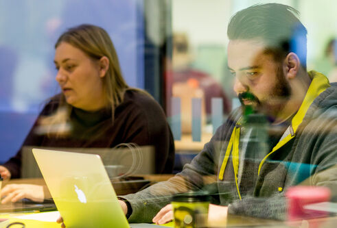 Group of students studying in a library