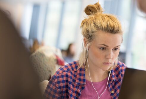 Student studying in an IT suite