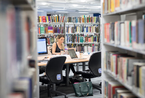 a student studying in a library