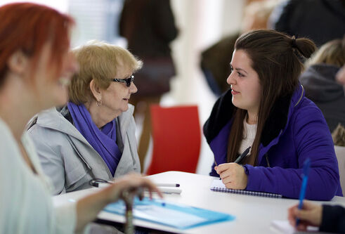 Student working with the public