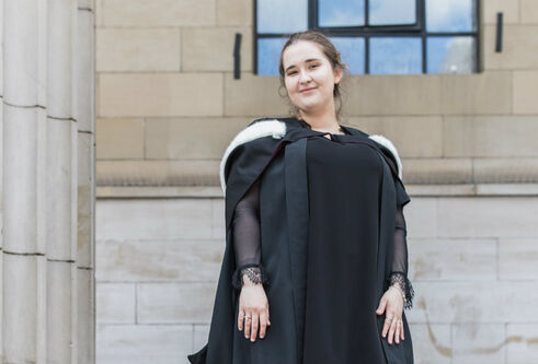 Aleksandra Mergo in a graduation gown outside Caird Hall