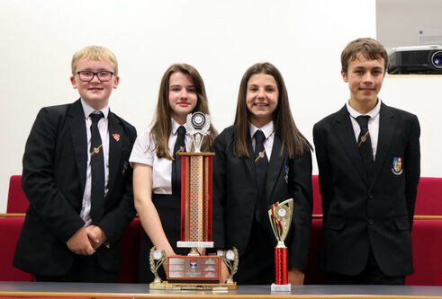 Pupils from Bathgate Academy posing with a trophy