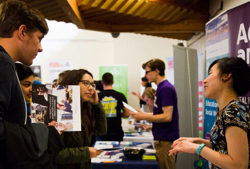 Students meeting employers at careers fair