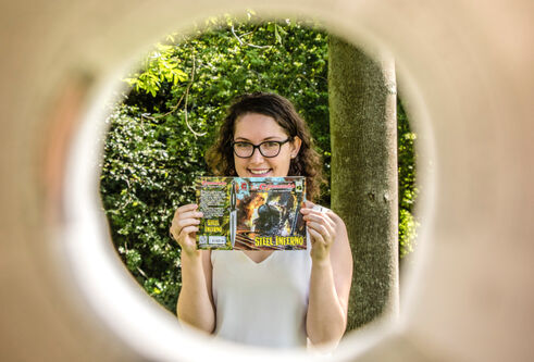 Hailey Austin holding up her comic book