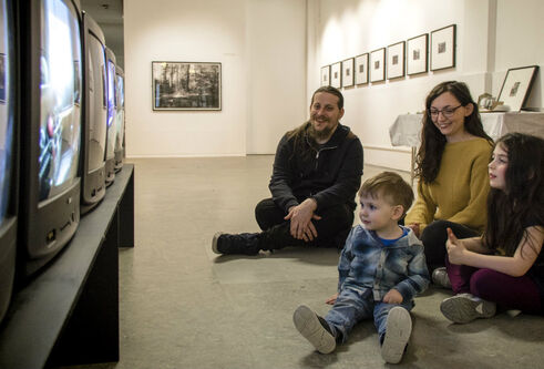 Family watching televisions