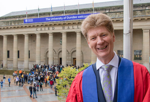 Jim Spence wearing his rector's robes