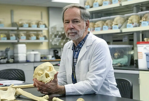 Bob Mann holding a skull