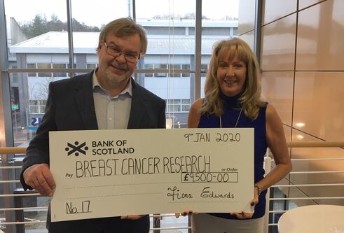 Prof Andy Evans receives cheque from Fiona Edwards