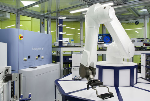 Picture of robot and microscope used in male fertility research