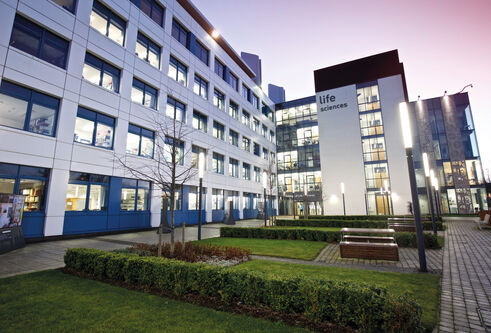 Photo of the Discovery Building at dusk