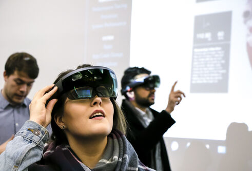 a woman with a mixed reality headset on