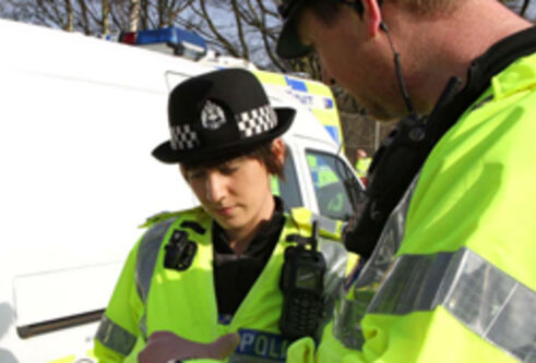 Police officer in high-visibility jacket