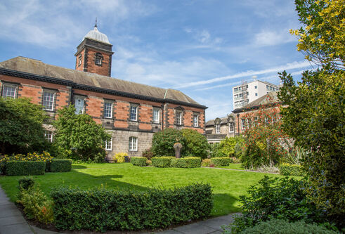 Red brick building with a little clock tower