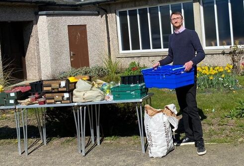 Neil Campbell organising food larder