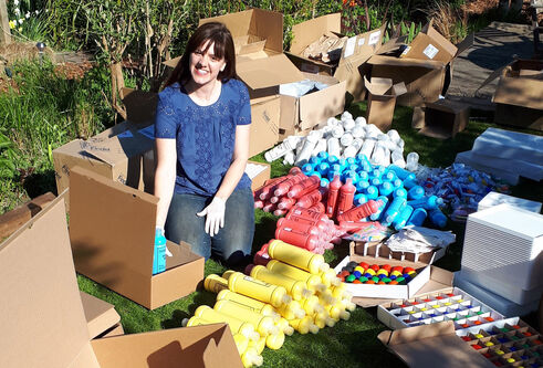 Vicky Armstrong packing boxes of art supplies