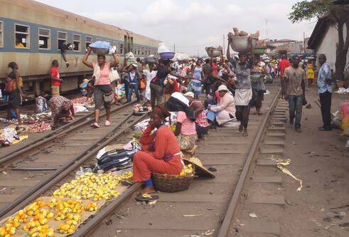 People selling goods at a railway station in Africa