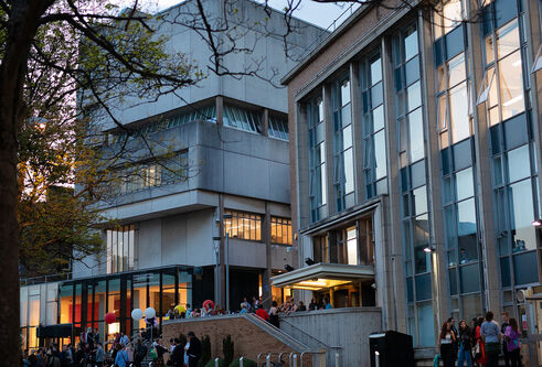 people standing outside the art school