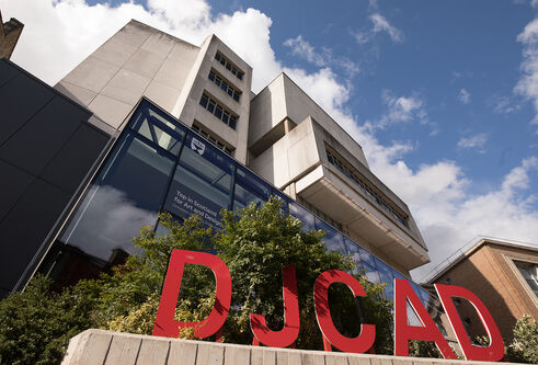 a building with the big red letters at the front saying DJCAD