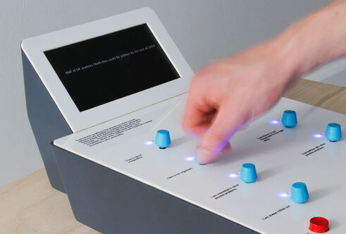 a hand pressing blue buttons on a machine