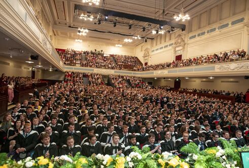 graduates sitting inside the Caird Hall