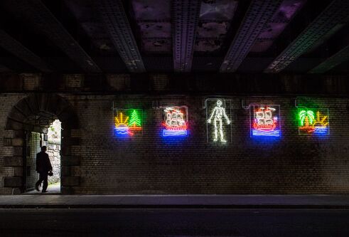 neon images on a wall