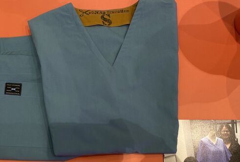 tayside teal scrubs set folded on table