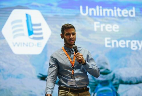 Photo of Harris-Angeli speaking at a conference