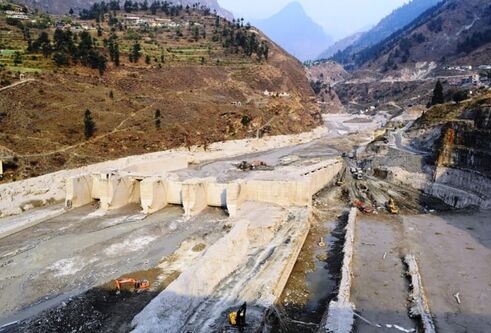 Grey rubble left from landslide - destroyed Tapovan Vishnugad hydroelectric plant