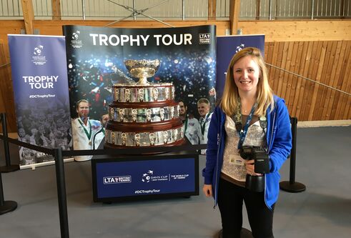 Sarah beside the Davis Cup Trophy