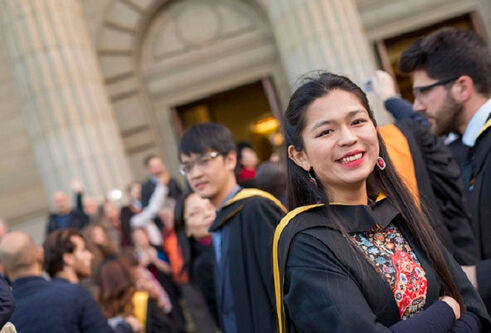 Xiaoxiao-Zhang standing outside Caird Hall after graduation