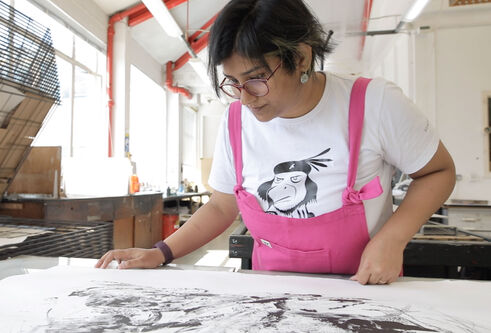 Dhira Chakraborty looking over her work
