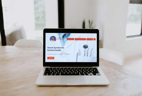 down syndrome dental health site on laptop