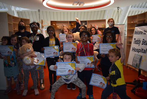 group of children holding certificates