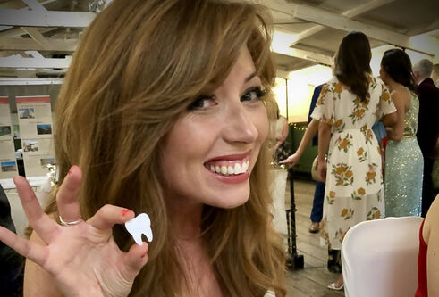Gemma Gaw holding a model tooth