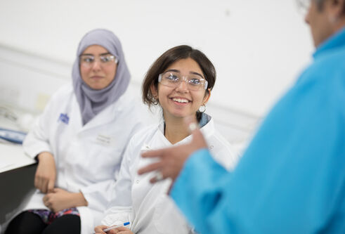 students in lab coats 