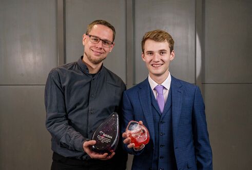 Ryan Anderson (right) with his Best Engineering Award standing with another win on his left