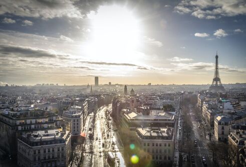 View of Paris and the Eiffel Tower with a bright winter sun low in the sky