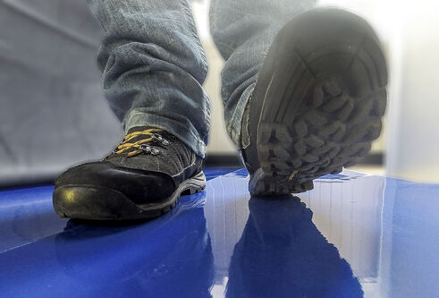 Sole of shoes leaving footprints