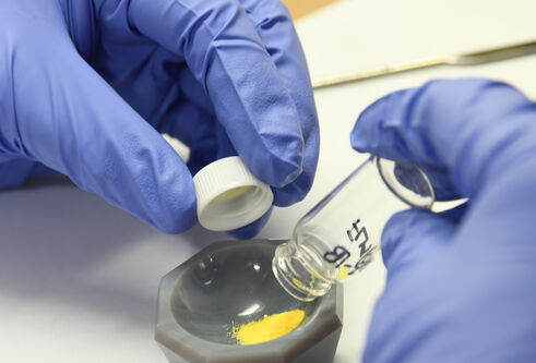 Scientist removes drugs from storage capsule