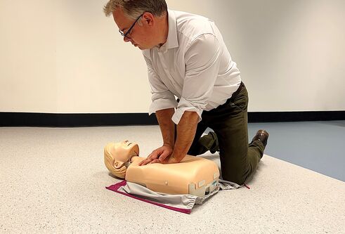 Dr Kevin Stirling, from the University's School of Health Sciences, demonstrating CPR on a teaching manikin
