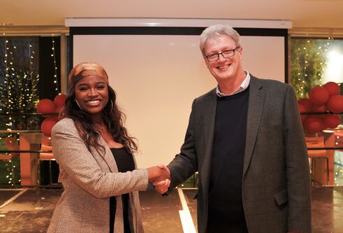 President of DUSA and Blair Grubb shaking hands