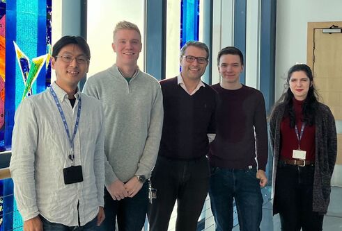 Five scientists from Dundee and Eisai standing in SLS building