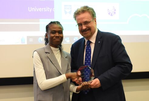 Lydia Konduah, winner of the School of Science and Engineering Award, being presented with a trophy at the venture final