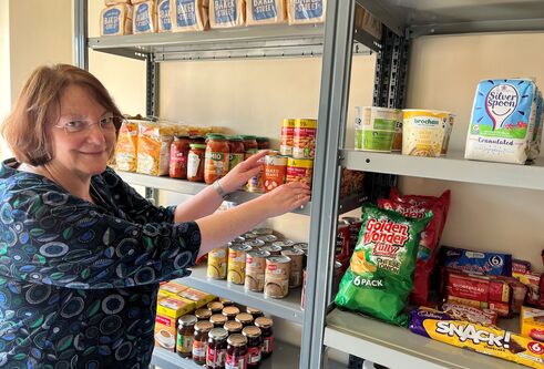 Dr Joan Cameron with items available in the new pantry