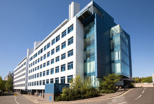 Sir James Black Centre a six story white and blue building on the Dundee city campus