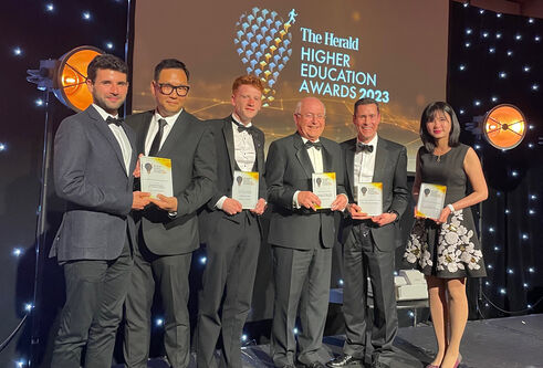 Dundee prize-winners on stage receiving their awards