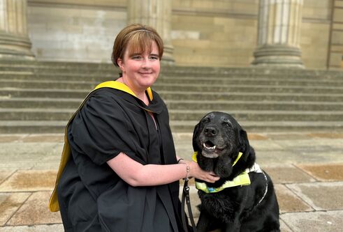 Leanne Moore and her guide dog Wanda posed by the Caird Hall