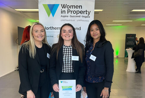 Pictured L to R- Morgan, Amy, Julianne standing in front of Women in Property Awards banner